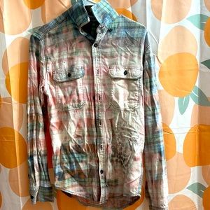 Pink/blue washed out flannel. Cheetah print on back and front.